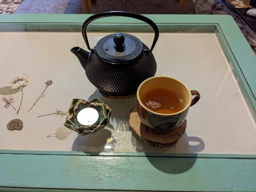 Tea and candle in reiki room